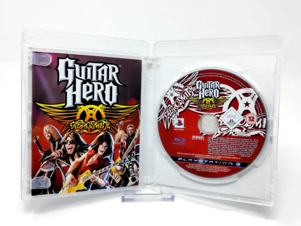 Interior del juego Guitar Hero: Aerosmith (ESP) para PlayStation 3 con disco y manual