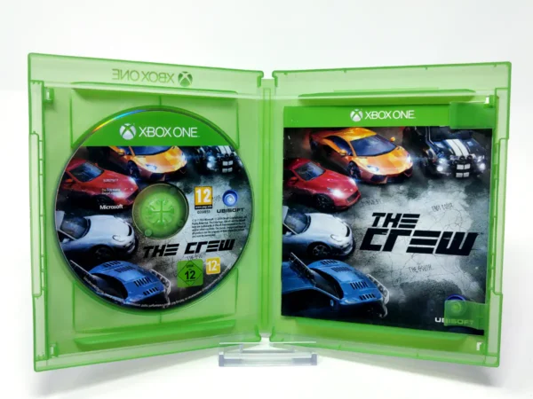 Interior del juego The Crew (ESP) para XBOX One / Series X/S con disco y manual