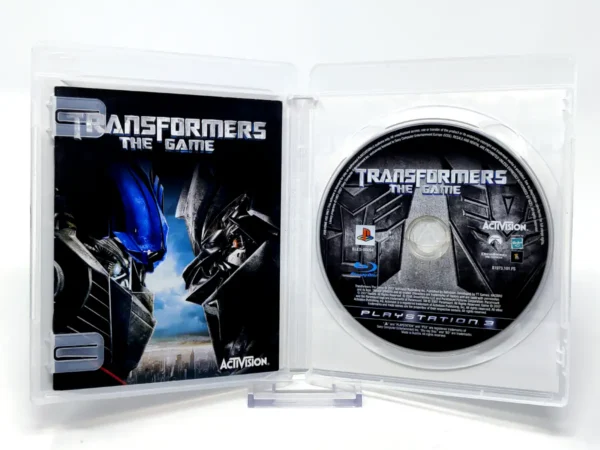 Interior del juego Transformers: The Game (ESP) para PlayStation 3 con disco y manual
