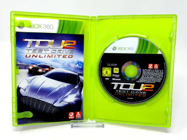 Interior del juego Test Drive Unlimited 2 (ESP) para XBOX 360 con disco y manual
