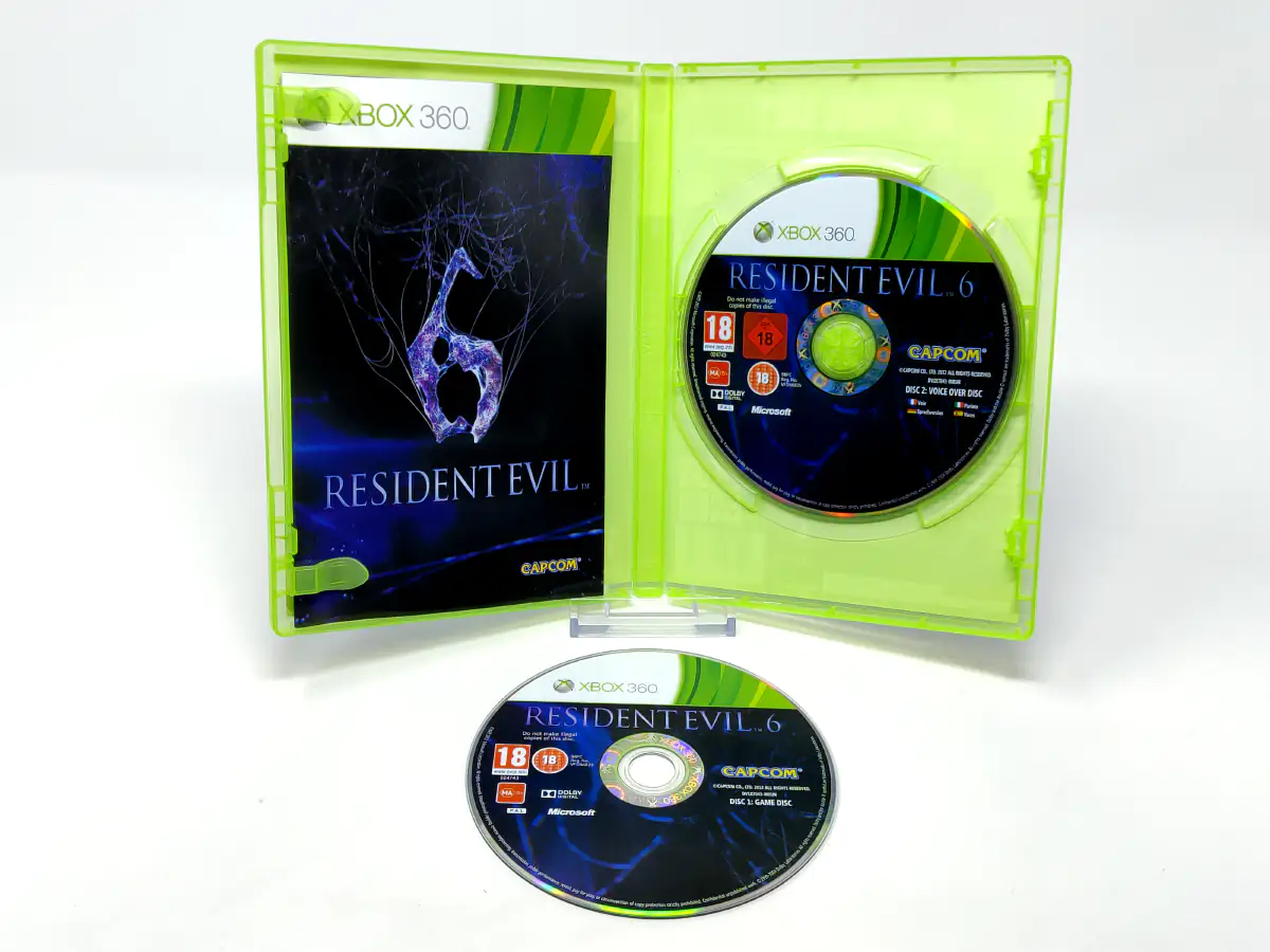 Interior del juego Resident Evil 6 (ESP) para XBOX 360 con disco y manual