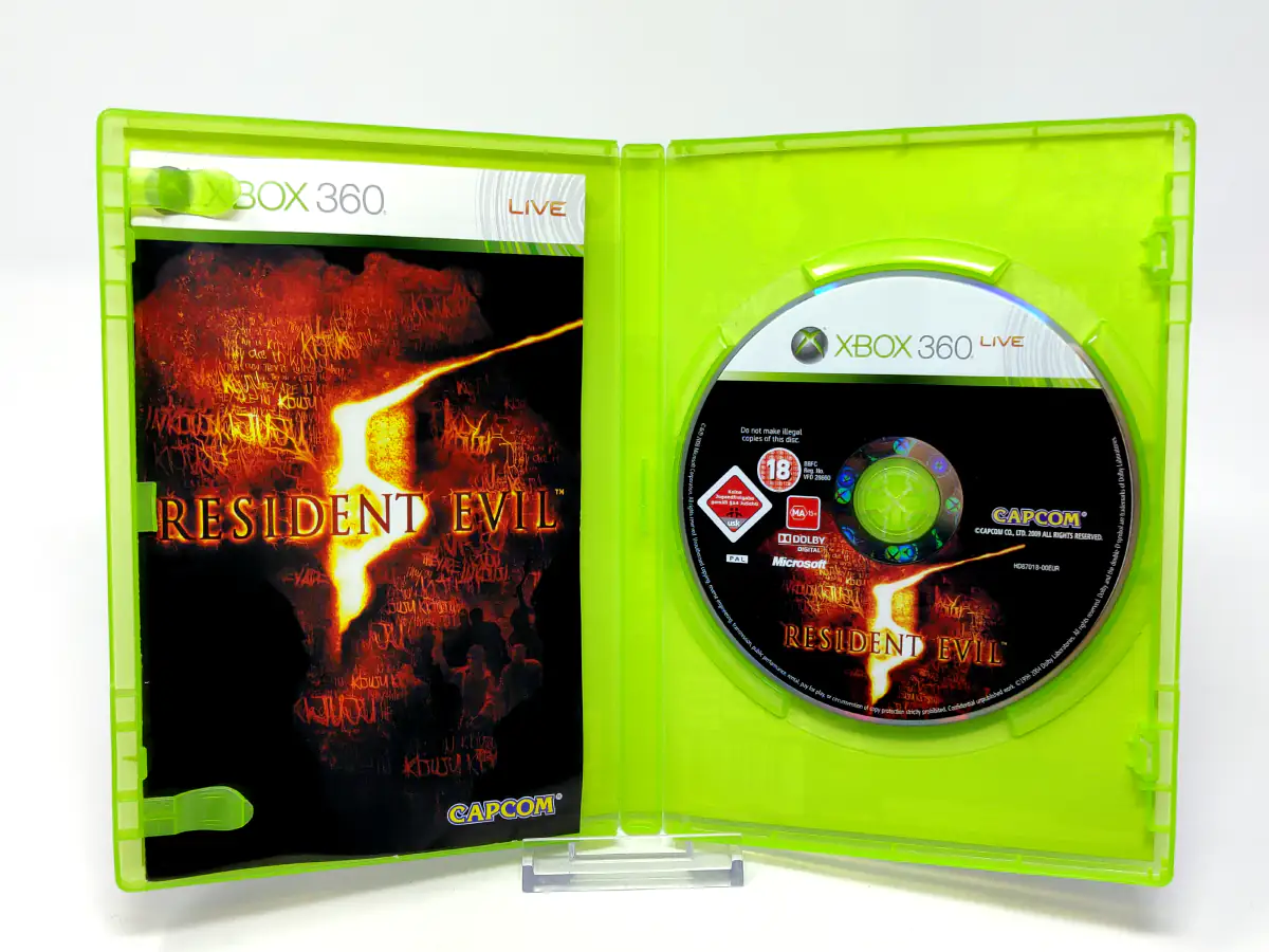 Interior del juego Resident Evil 5 (ESP) para XBOX 360 con disco y manual