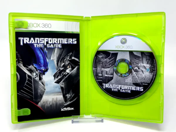 Interior del juego Transformers: The Game (ESP) para XBOX 360 con disco y manual