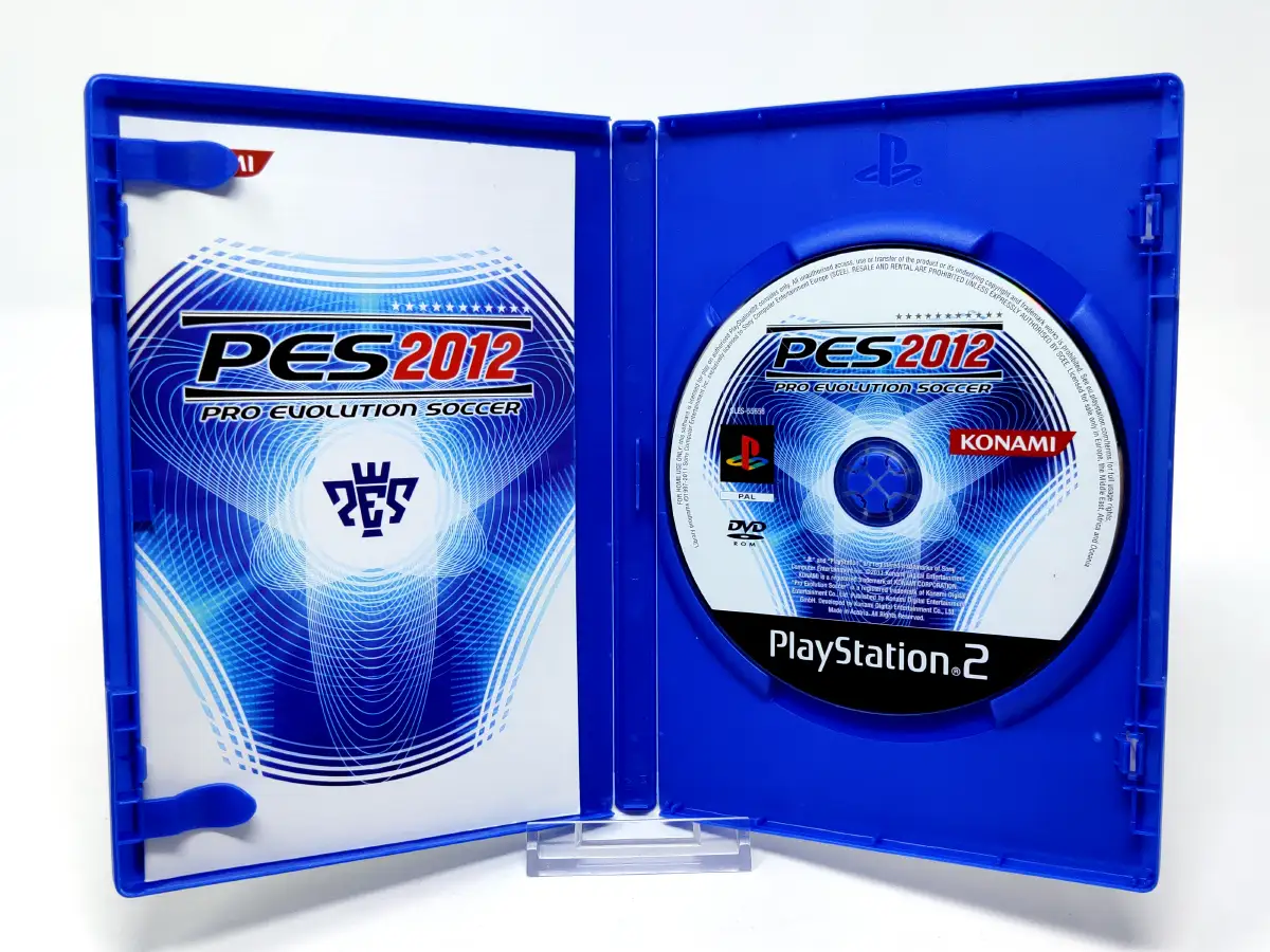 Interior del juego PES 2012: Pro Evolution Soccer (ESP) para PlayStation 2 con disco y manual