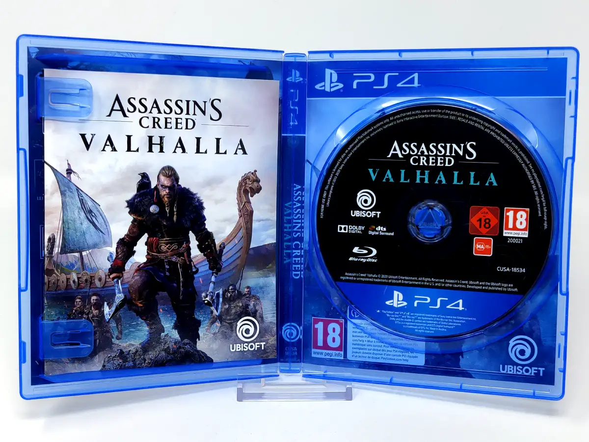Interior del juego Assassin's Creed Valhalla (FRA) para PlayStation 4 con disco y manual
