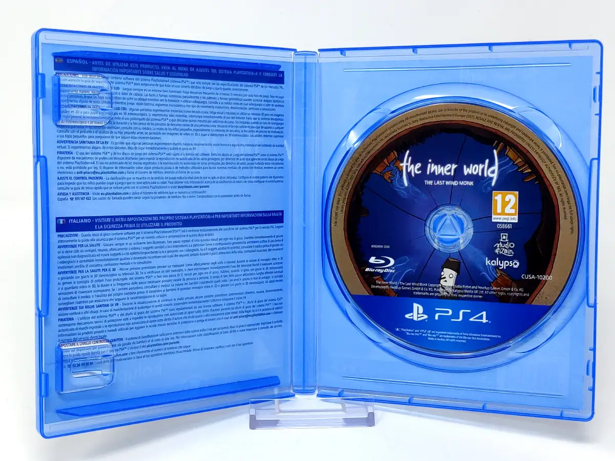 Interior del juego The Inner World: The Last Wind Monk (ESP) para PlayStation 4 con disco y manual