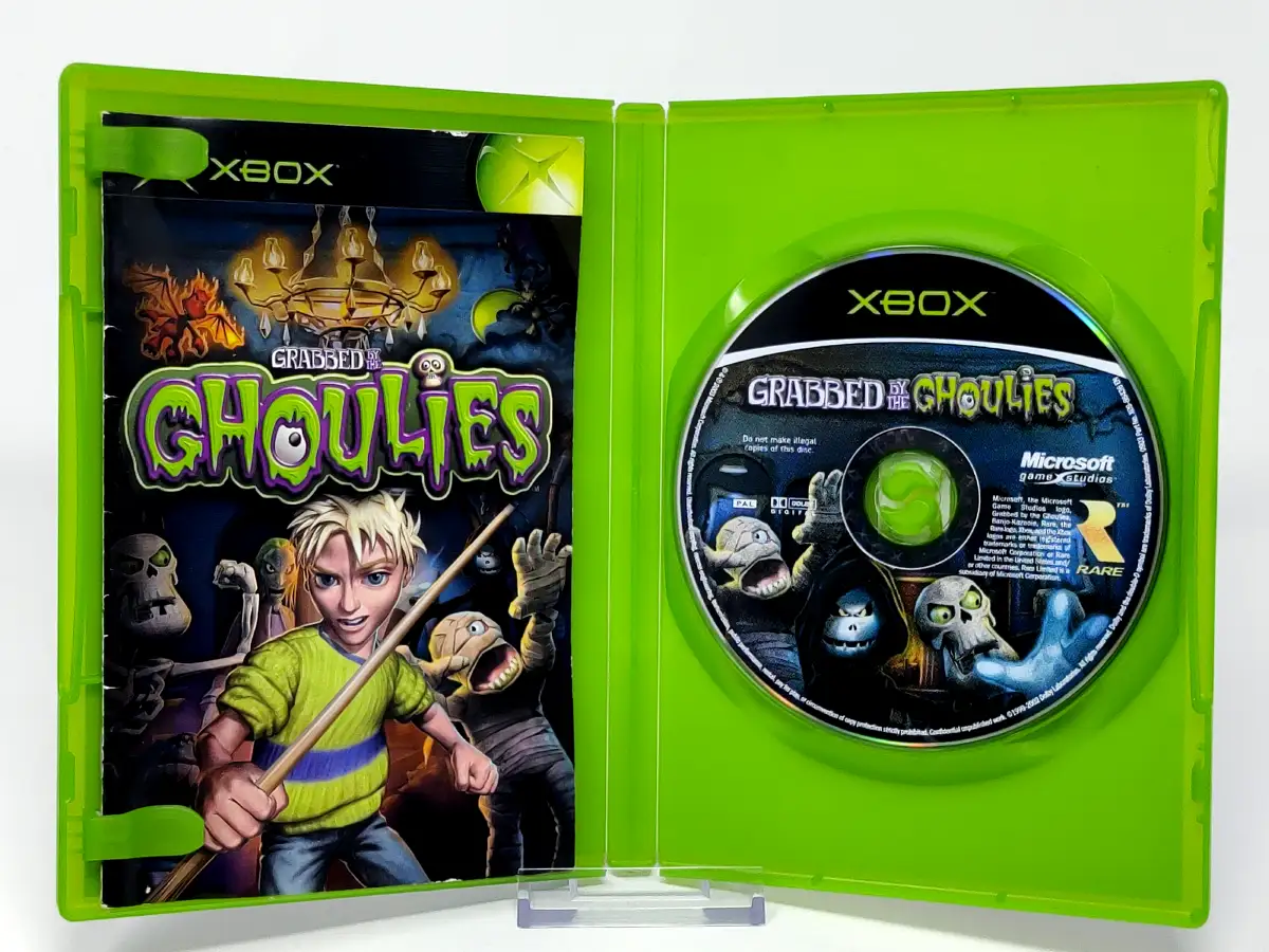 Interior del juego Grabbed by the Ghoulies (ESP) para XBOX con disco y manual