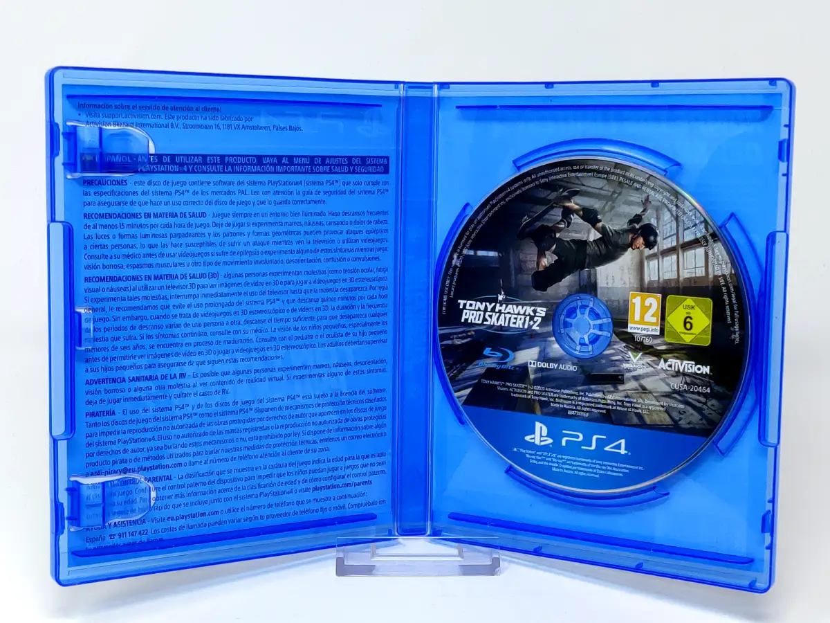 Interior del juego Tony Hawk's Pro Skater 1 + 2 (ESP) para PlayStation 4 con disco y manual