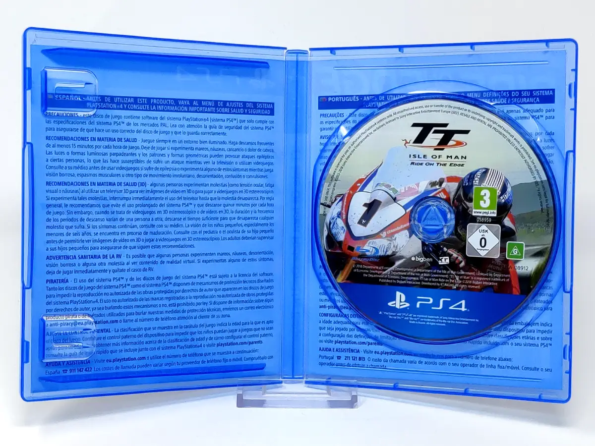 Interior del juego TT Isle of Man: Ride on the Edge (ESP) para PlayStation 4 con disco y manual