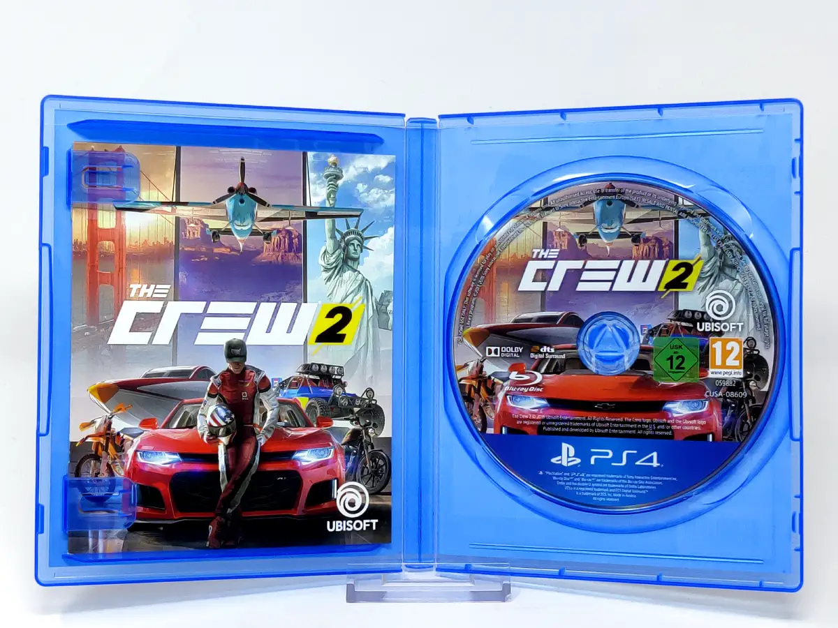 Interior del juego The Crew 2 (ESP) para PlayStation 4 con disco y manual