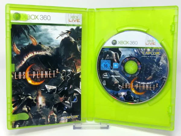 Interior del juego Lost Planet 2 (UK) para XBOX 360 con disco y manual