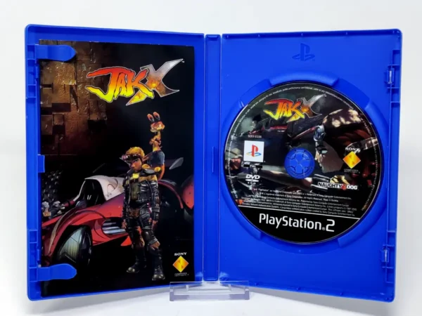 Interior del juego Jak X (EUR) (Platinum) para PlayStation 2 con disco y manual