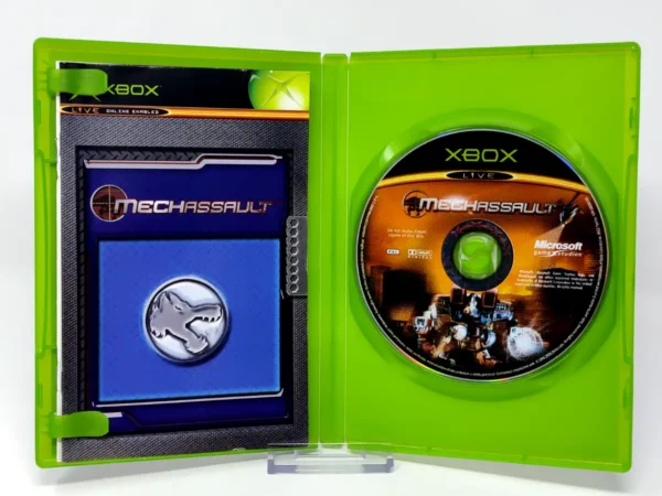 Interior del juego MechAssault (UK) para XBOX con disco y manual