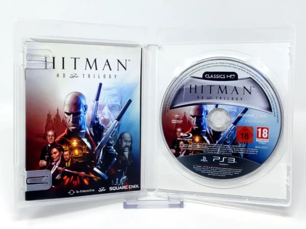 Interior del juego Hitman HD Trilogy (ESP) para PlayStation 3 con disco y manual