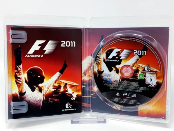 Interior del juego F1 2011 (ESP) para PlayStation 3 con disco y manual