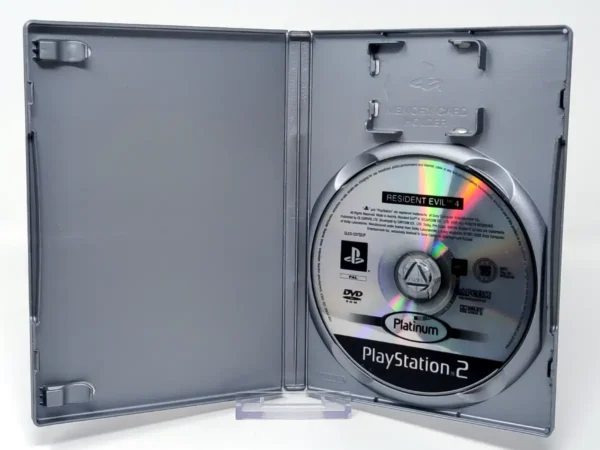 Interior del juego Resident Evil 4 (ESP) (Platinum) (Rebajado) para PlayStation 2 con disco y manual