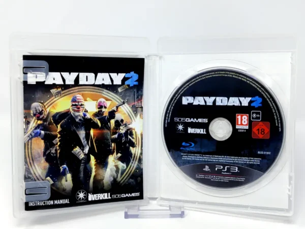 Interior del juego Payday 2 (UK) para PlayStation 3 con disco y manual