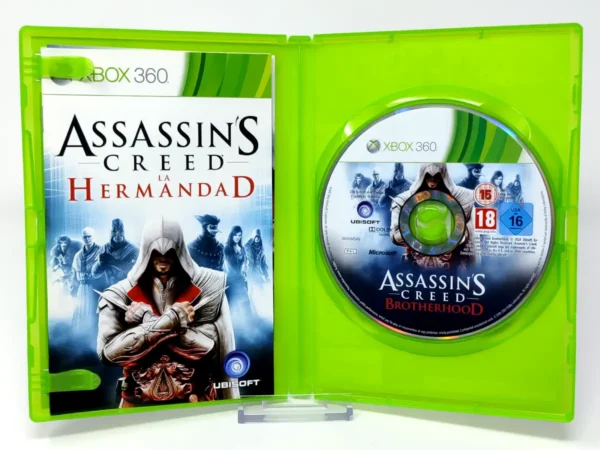 Interior del juego Assassin's Creed: La Hermandad (ESP) (v2) para XBOX 360 con disco y manual