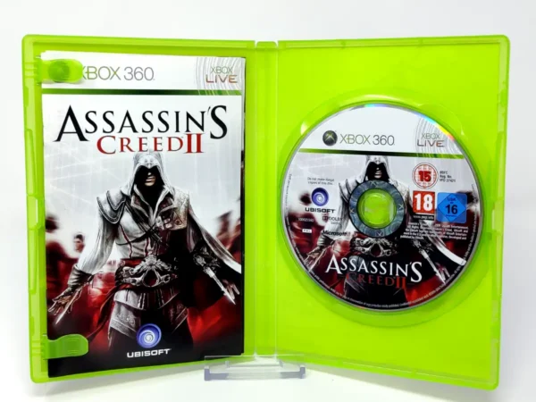 Interior del juego Assassin's Creed II (ESP) (v2) para XBOX 360 con disco y manual